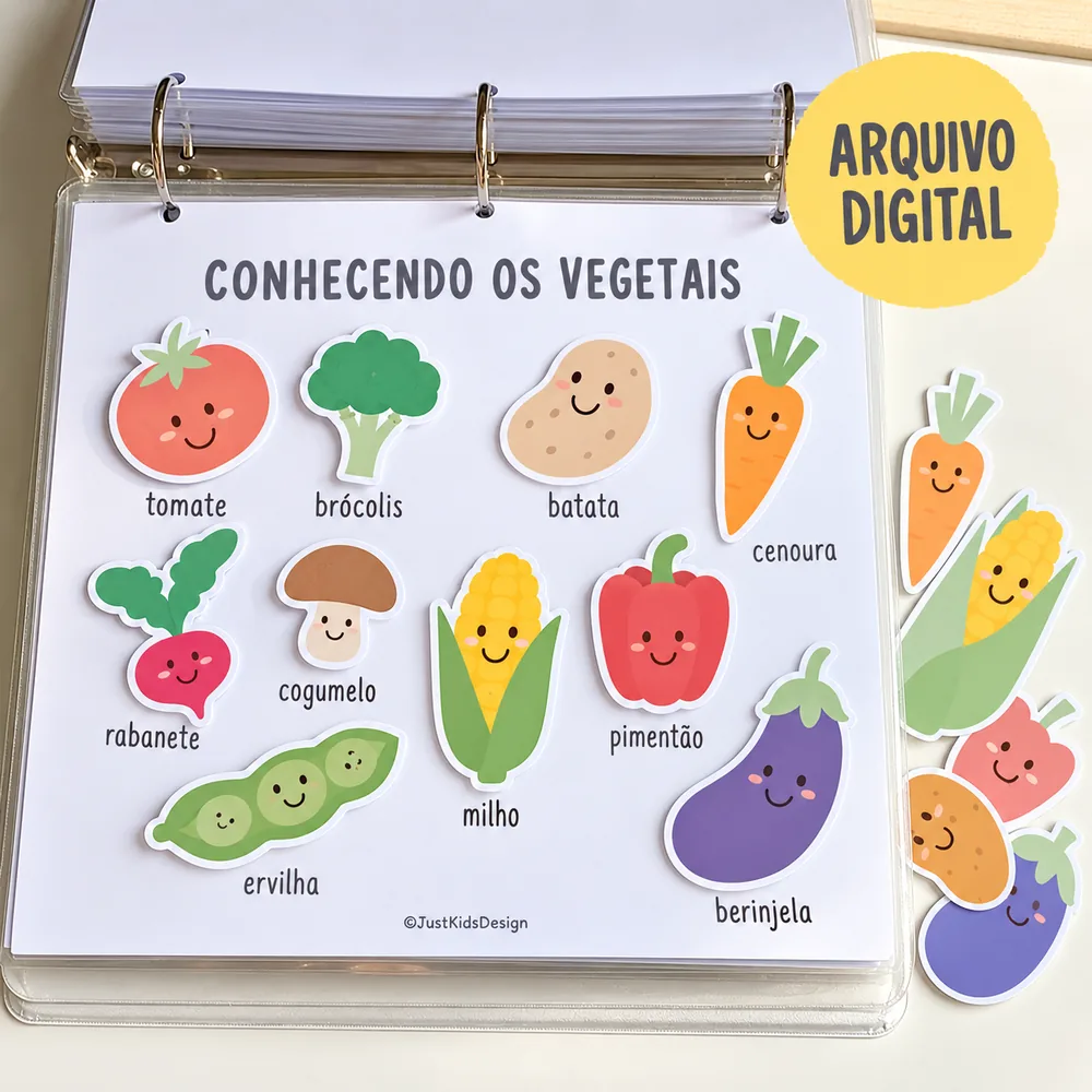 Página aberta em fichário com recortes de vegetais, como tomate, brócolis, cenoura, milho e berinjela